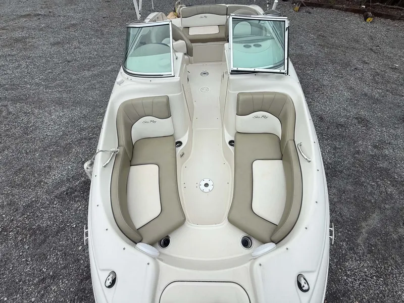 Slide: The Image of Interior view of a 2006 Sea Ray 200 SD boat with beige seating. - 8