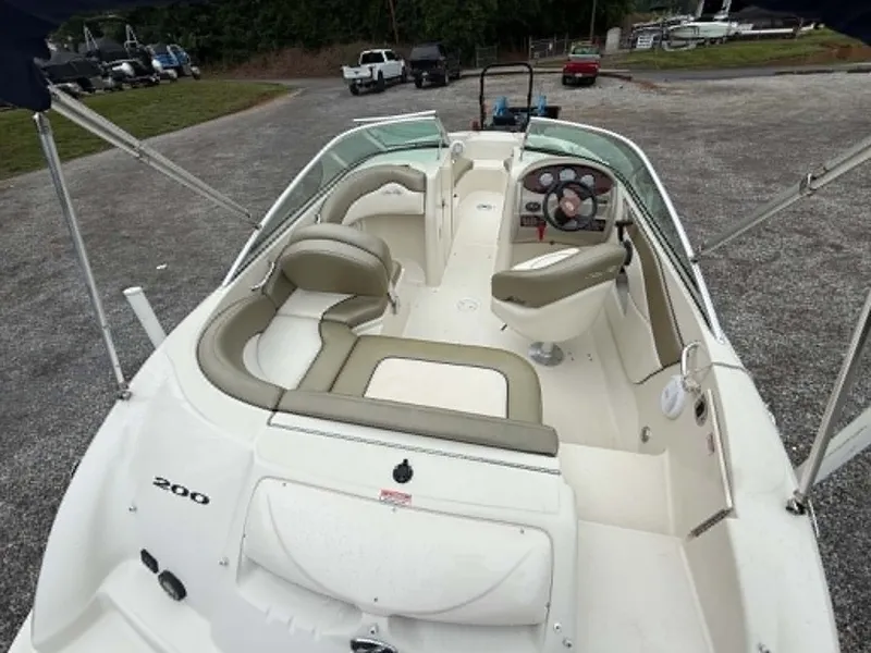 Slide: The Image of Interior view of a 2006 Sea Ray 200 SD boat on a parking lot. - 9