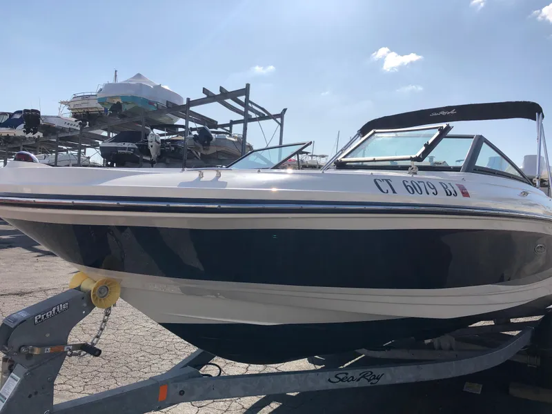 Slide: The Image of 2017 Sea Ray 21 SPX boat on trailer outdoors. - 2