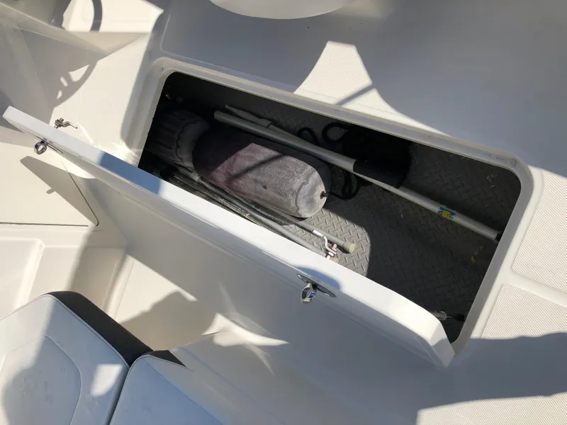 Slide: The Image of Storage compartment in 2017 Sea Ray 21 SPX boat. - 22