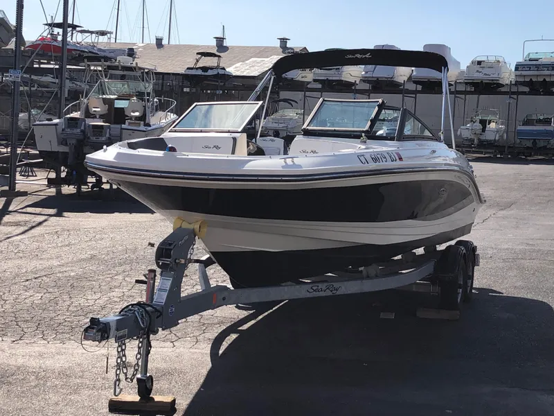 Slide: The Image of 2017 Sea Ray 21 SPX boat on trailer at marina. - 5