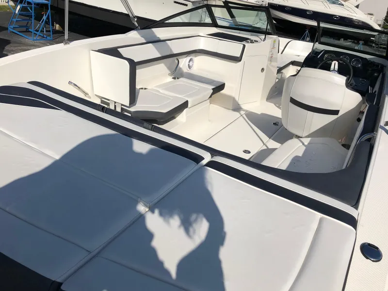 Slide: The Image of Interior of a 2017 Sea Ray 21 SPX boat with white seating. - 9
