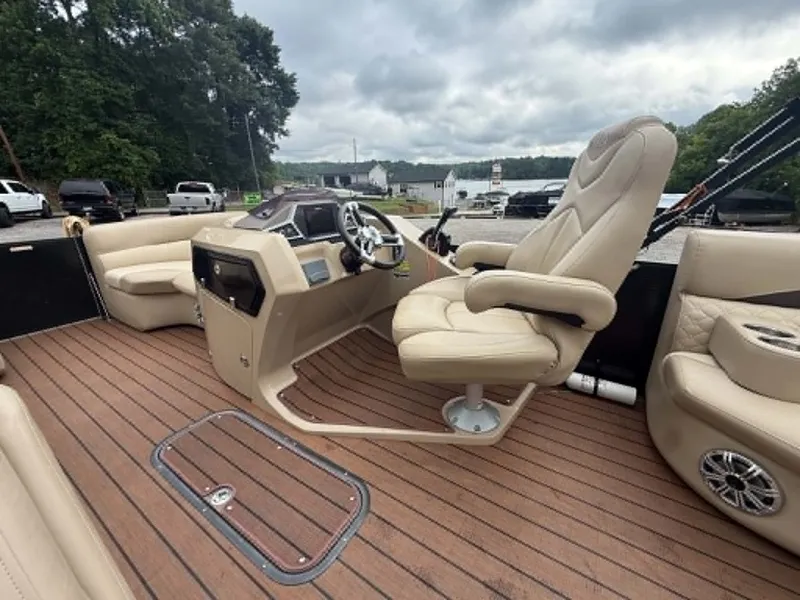 Slide: The Image of Interior of a 2019 Manitou SES 230 boat with luxurious seating. - 11