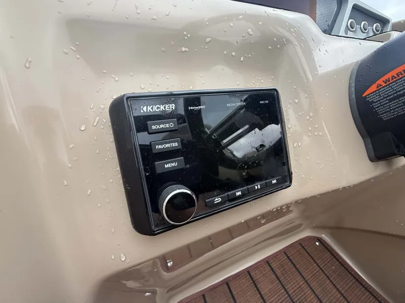 Slide: The Image of Kicker media center in 2019 Manitou SES 230 boat. - 12