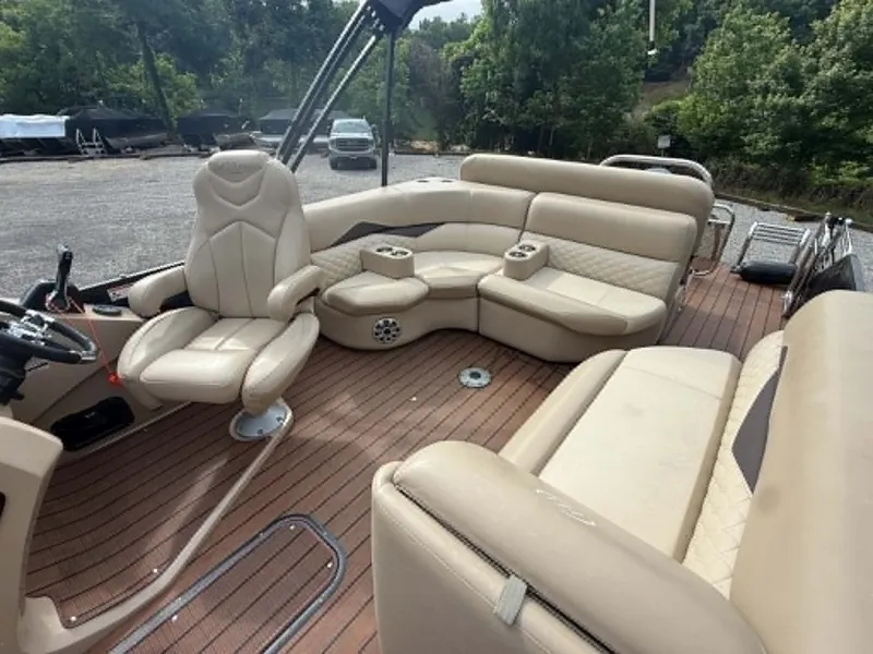 Slide: The Image of Interior of a 2019 Manitou SES 230 pontoon boat with beige leather seating. - 17
