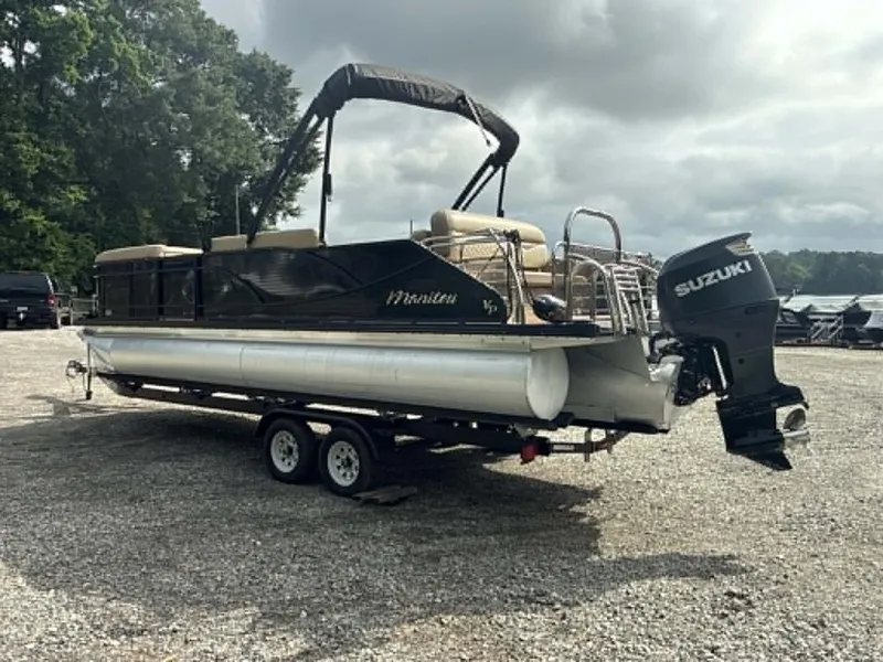 Slide: The Image of 2019 Manitou SES 230 pontoon boat with Suzuki outboard motor. - 25