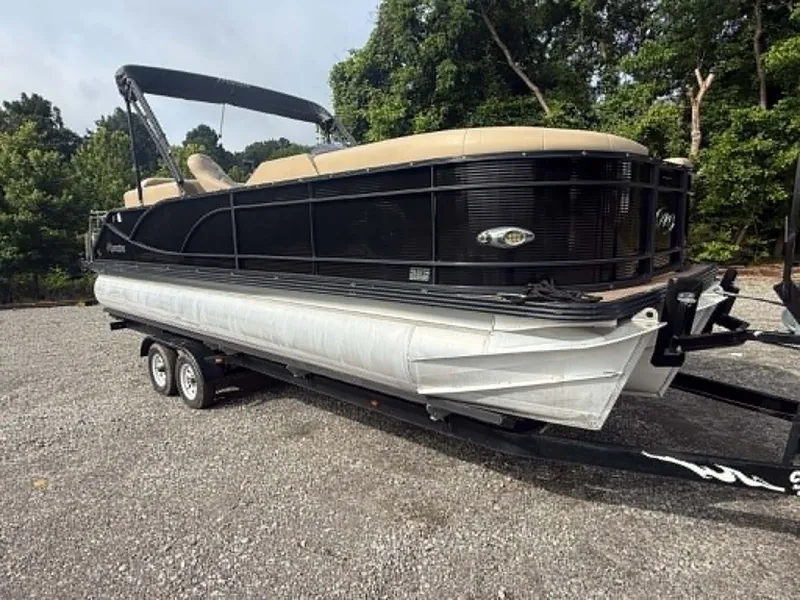 Slide: The Image of 2019 Manitou SES 230 pontoon boat on trailer outdoors. - 31