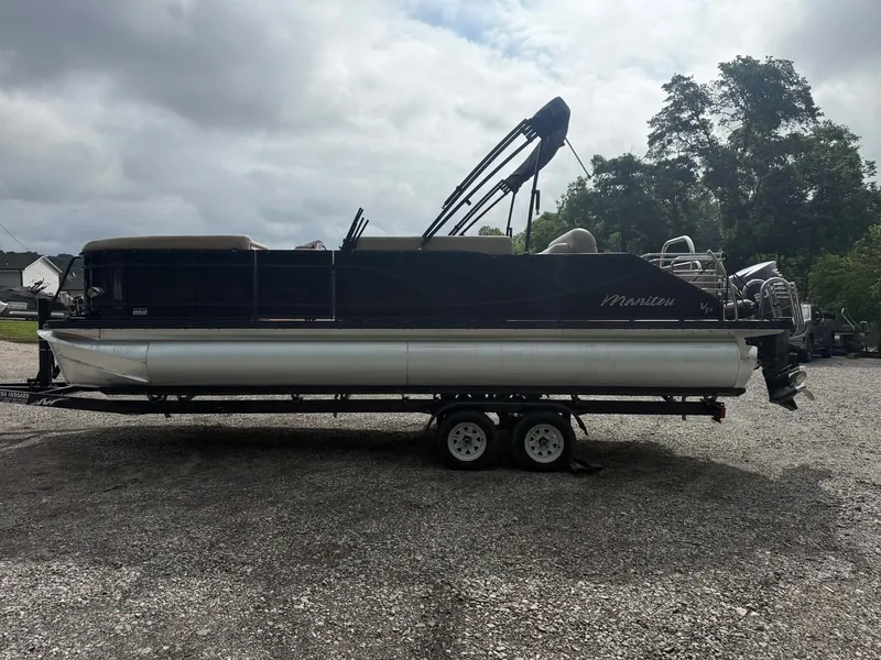 Slide: The Image of 2019 Manitou SES 230 pontoon boat on trailer, side view. - 4