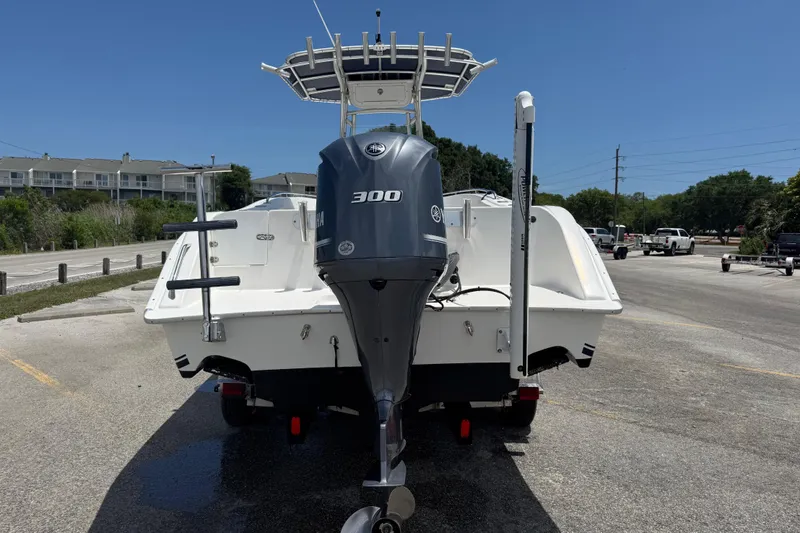 Slide: The Image of 2016 Cape Horn 22 OS boat with Yamaha 300 engine, parked in a sunny lot. - 11