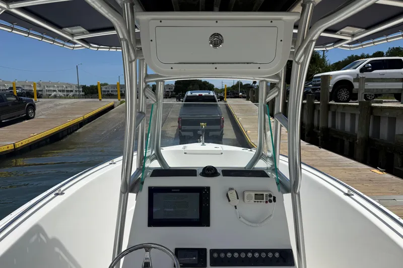 Slide: The Image of 2016 Cape Horn 22 OS boat at dock, view from helm with truck in background. - 15