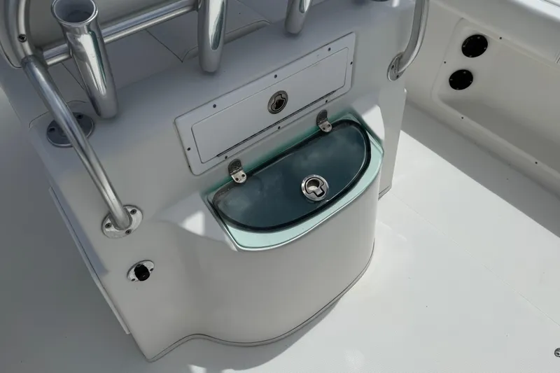 Slide: The Image of 2016 Cape Horn 22 OS boat console with storage compartment and rod holders. - 17