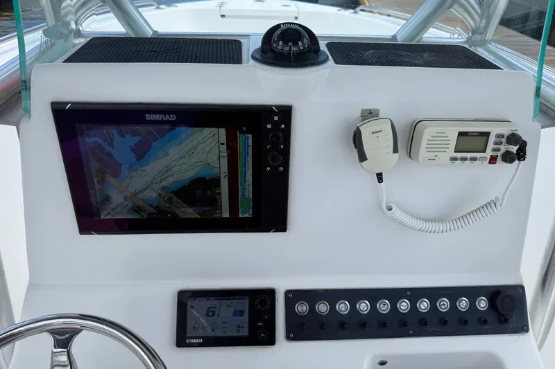 Slide: The Image of 2016 Cape Horn 22 OS boat dashboard with navigation and communication equipment. - 21