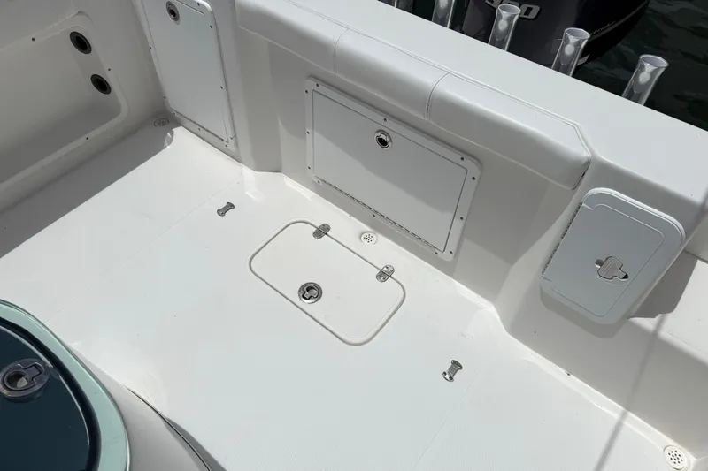 Slide: The Image of 2016 Cape Horn 22 OS boat deck with storage compartments and rod holders. - 27