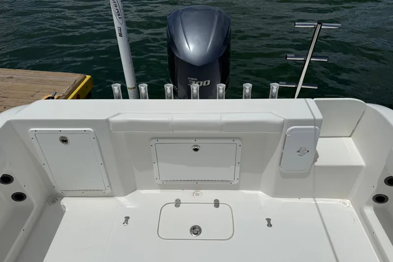 Slide: The Image of 2016 Cape Horn 22 OS boat deck with Yamaha 300 engine, docked by the water. - 28
