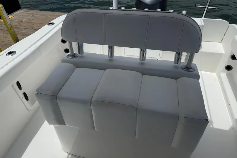 Slide: The Image of 2016 Cape Horn 22 OS boat seating with rod holders, dockside view. - 29
