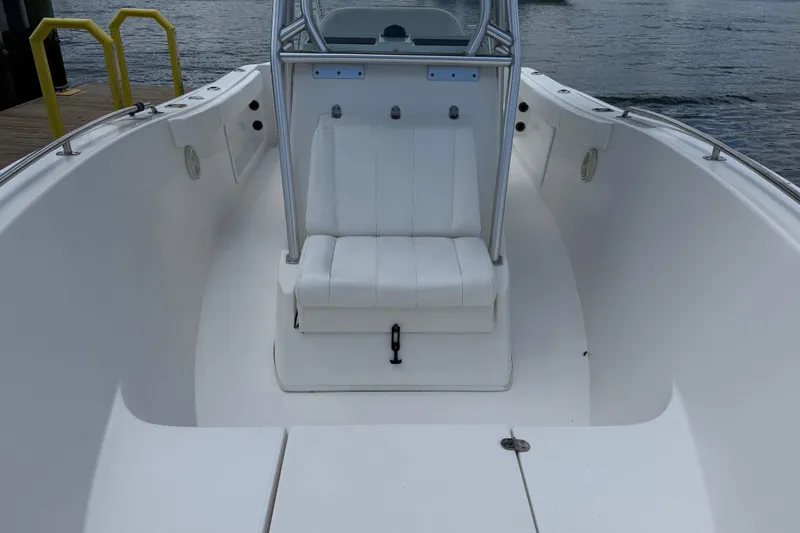 Slide: The Image of 2016 Cape Horn 22 OS boat interior with white seating and open deck. - 35