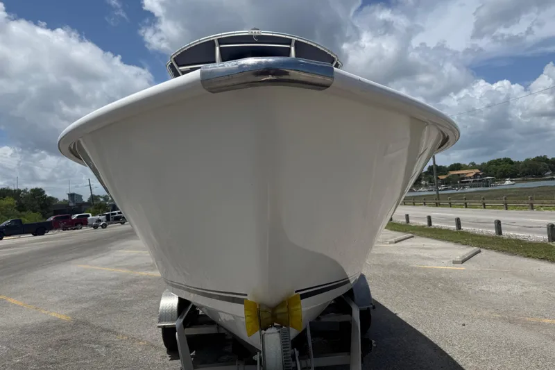 Slide: The Image of 2016 Cape Horn 22 OS boat on trailer under cloudy sky. - 6