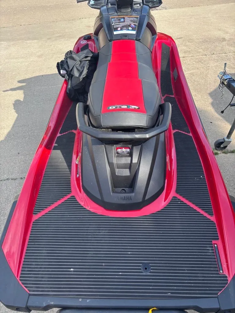 Slide: The Image of 2025 Yamaha VX Deluxe jet ski in red and black. - 3