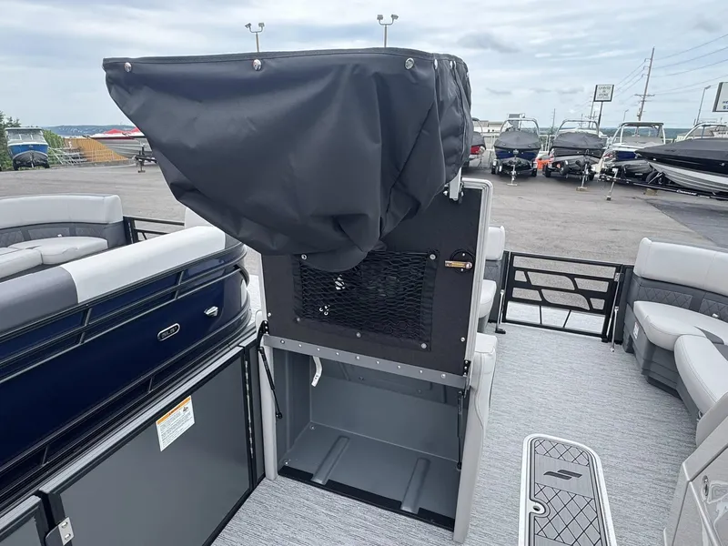 Slide: The Image of Starcraft SLS-5 R 2026 pontoon boat with cover at marina. - 24