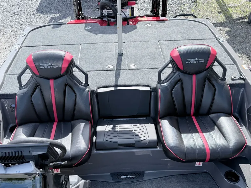 Slide: The Image of Skeeter ZXE21 2026 boat seats with black and red design. - 15
