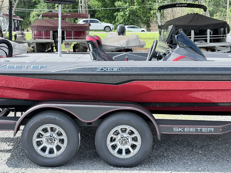 Slide: The Image of 2026 Skeeter ZXE21 boat on trailer, side view. - 17