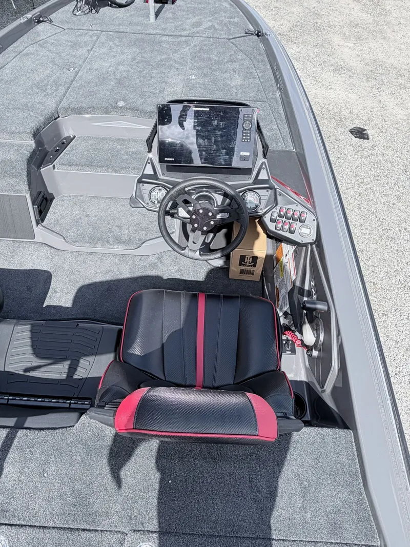 Slide: The Image of Interior of a 2026 Skeeter ZXE21 boat with steering console. - 20