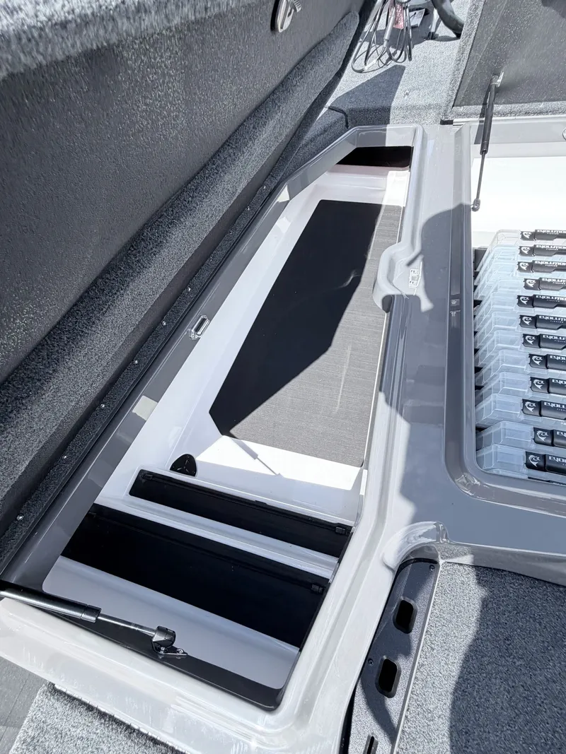 Slide: The Image of Interior view of Skeeter ZXE21 2026 boat storage compartment. - 24