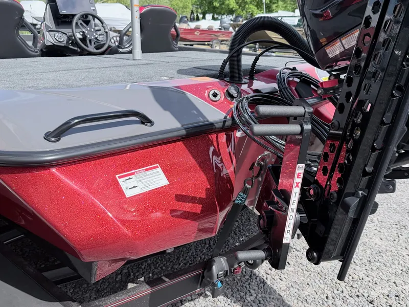 Slide: The Image of Red Skeeter ZXE21 boat, 2026 model, featuring modern steering area. - 25