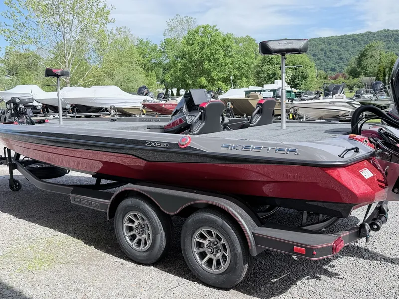 Slide: The Image of 2026 Skeeter ZXE21 boat parked on trailer outdoors. - 30