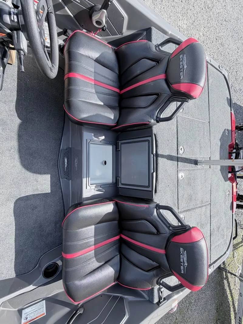 Slide: The Image of Interior of 2026 Skeeter ZXE21 with black and red seats. - 32