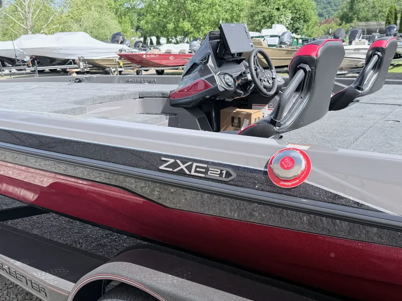 Slide: The Image of 2026 Skeeter ZXE21 boat with sleek cockpit and red accents. - 34