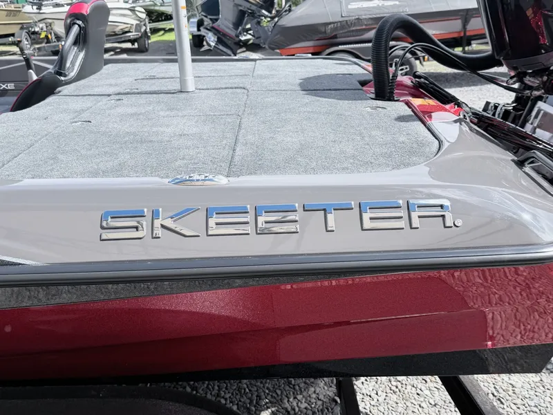 Slide: The Image of Skeeter ZXE21 2026 boat with gray deck and red accent. - 36
