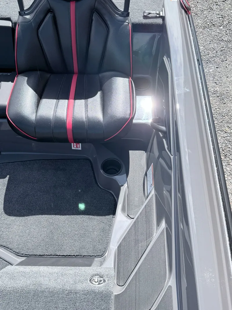 Slide: The Image of Skeeter ZXE21 2026 boat seat with black leather and red accents. - 37