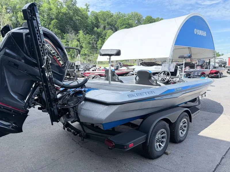 Slide: The Image of 2026 Skeeter ZXE20 boat on trailer, Yamaha motor, displayed outdoors. - 29