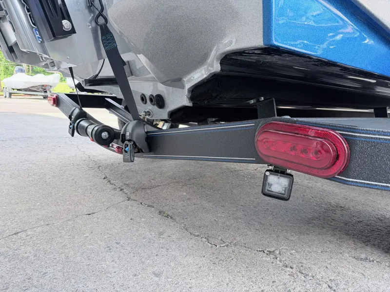 Slide: The Image of Skeeter ZXE20 2026 boat trailer with taillight and hitch. - 31
