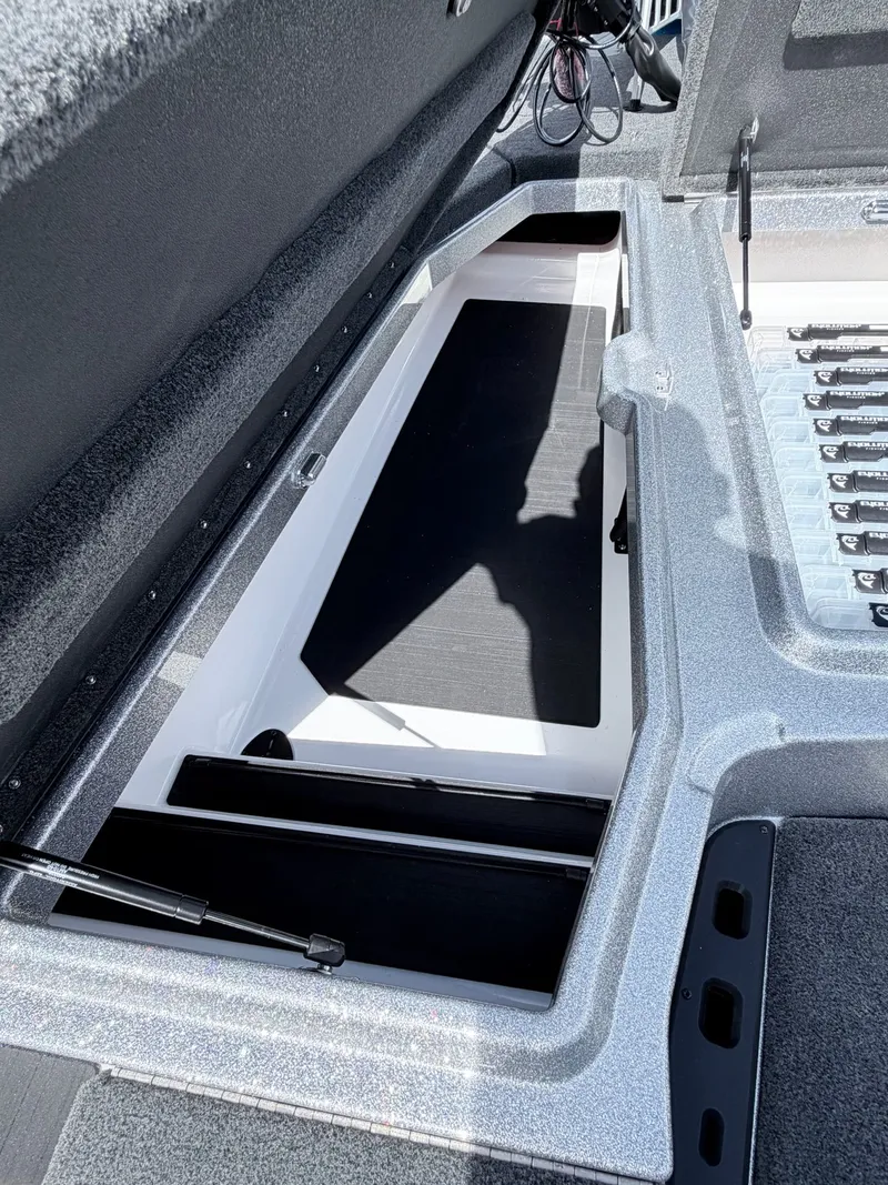 Slide: The Image of Interior view of Skeeter ZXE20 2026 boat storage compartment. - 33