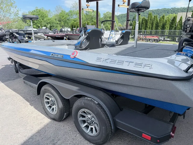Slide: The Image of 2026 Skeeter ZXE20 boat parked on trailer outdoors. - 34
