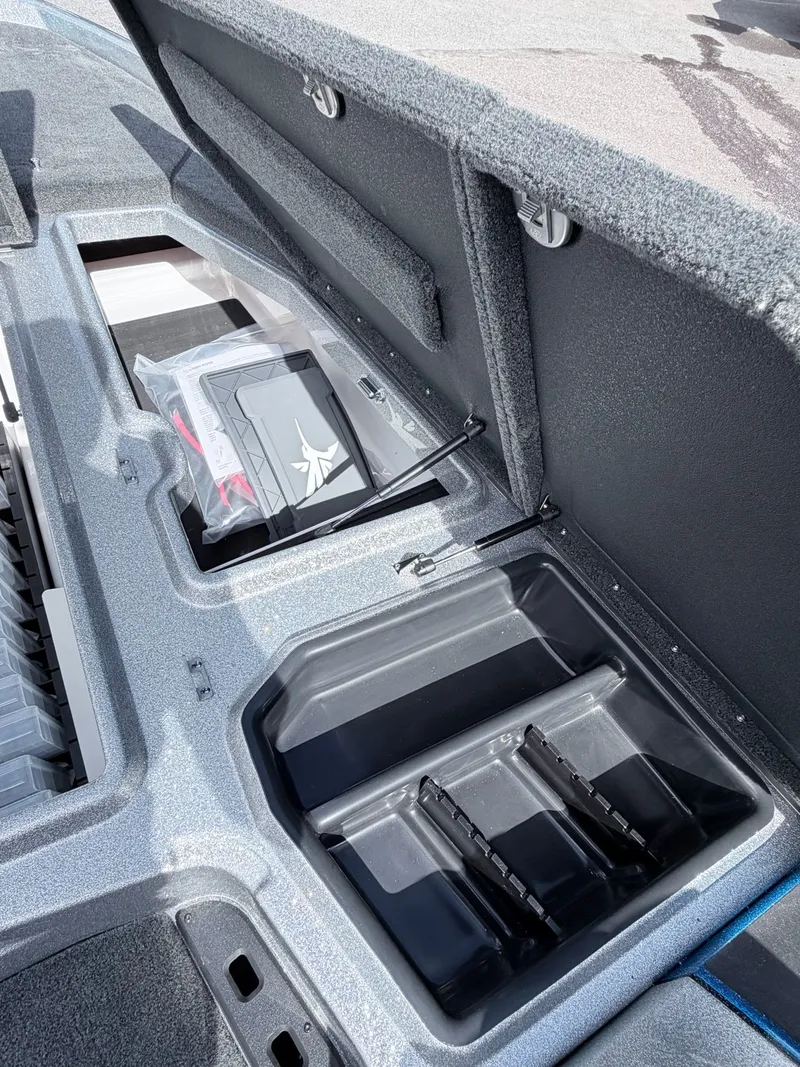 Slide: The Image of Open storage compartment in 2026 Skeeter ZXE20 boat. - 38
