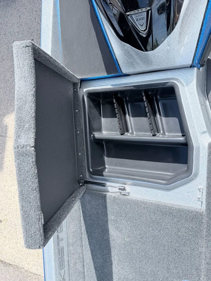 Slide: The Image of Skeeter ZXE20 2026 boat compartment with open storage space. - 5