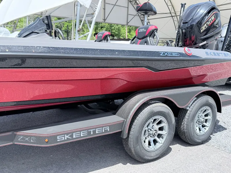 Slide: The Image of Red Skeeter ZXE20 boat trailer, 2026 model, with dual axle. - 17