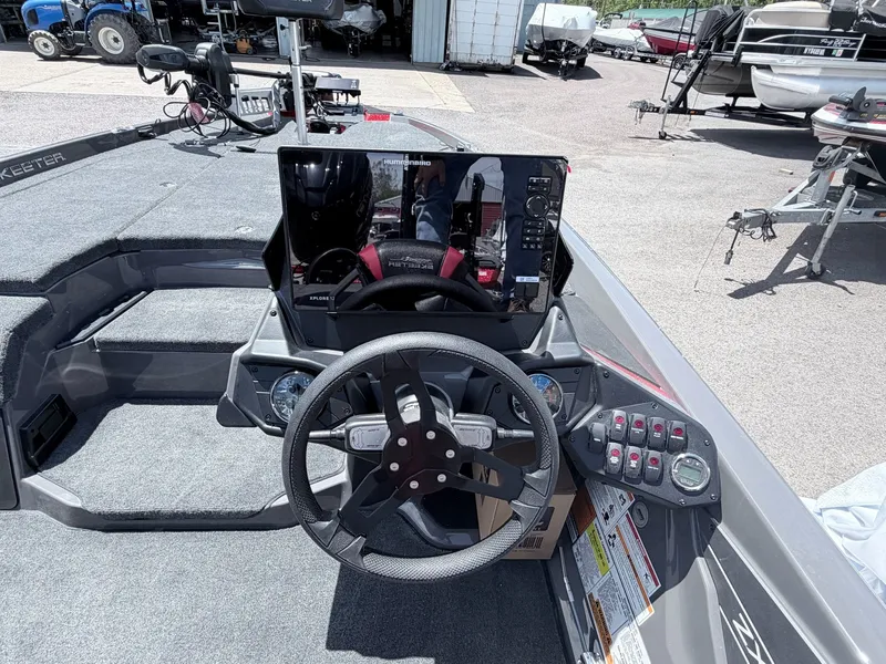Slide: The Image of Skeeter ZXE20 2026 boat console with steering wheel and electronics. - 24