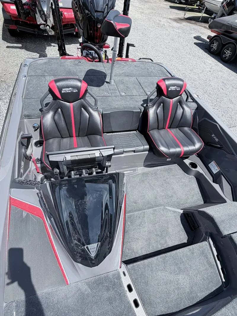 Slide: The Image of Interior of 2026 Skeeter ZXE20 with black and red seats. - 28