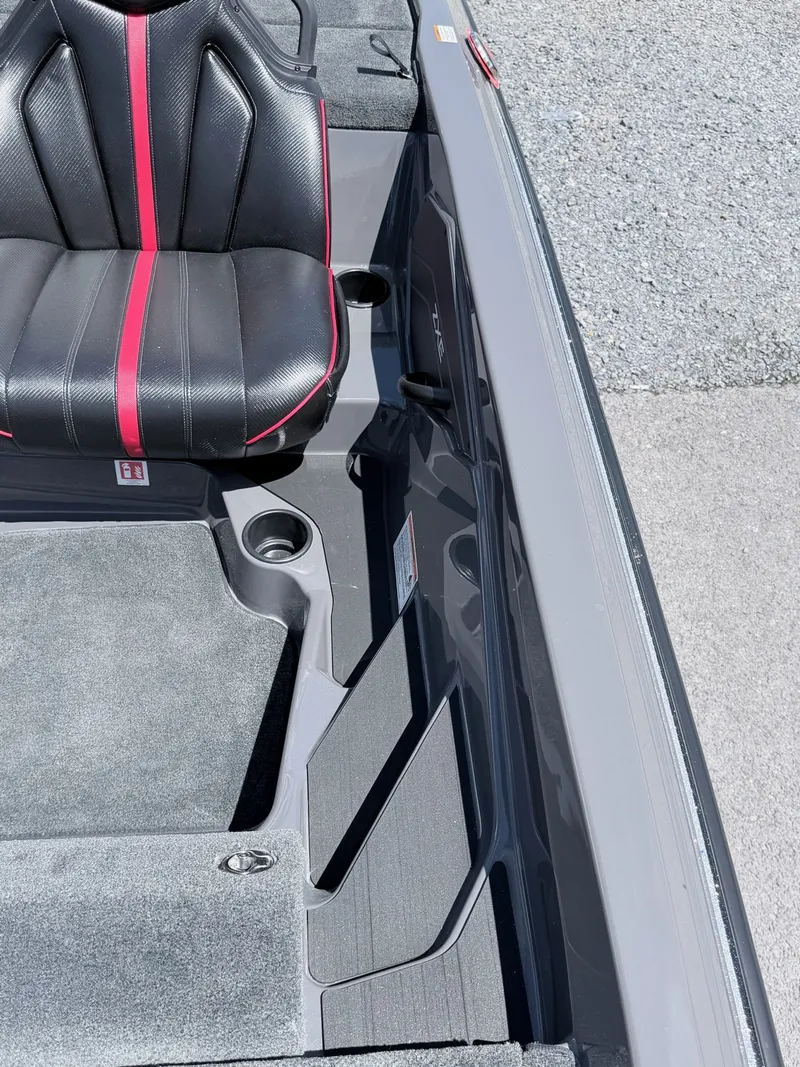 Slide: The Image of Interior of Skeeter ZXE20 boat, seat with red accents, model year 2026. - 32