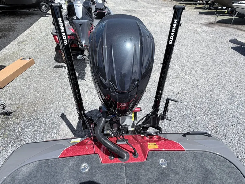 Slide: The Image of Skeeter ZXE20 2026 with Minn Kota motor on gray gravel. - 36