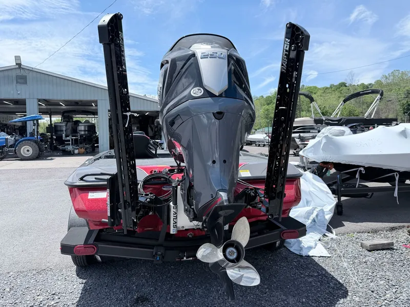 Slide: The Image of Rear view of a 2026 Skeeter ZXE20 boat model with outboard motor. - 41