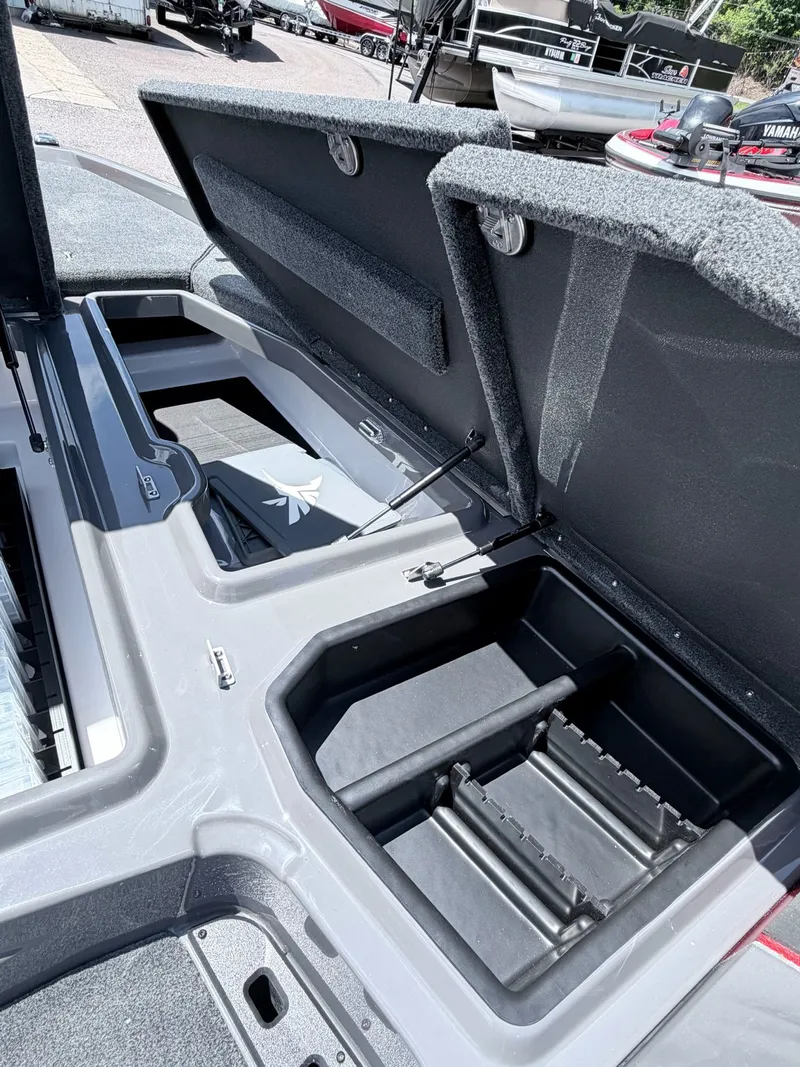 Slide: The Image of Open storage compartments in Skeeter ZXE20 boat, model 2026. - 42