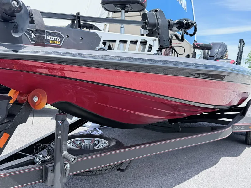 Slide: The Image of Red Skeeter ZXE20 boat from 2026 on a trailer. - 8