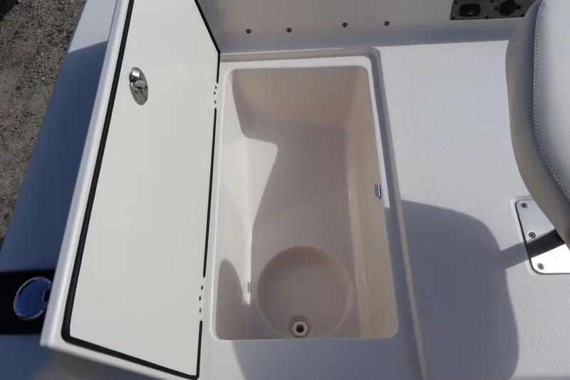 Slide: The Image of Open storage compartment in 2023 Carolina Skiff 17 LS boat. - 16