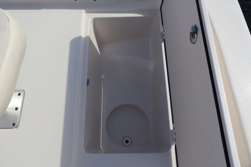 Slide: The Image of Interior of 2023 Carolina Skiff 17 LS boat, storage compartment view. - 17