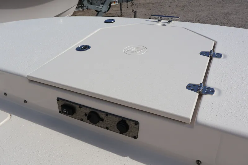 Slide: The Image of 2023 Carolina Skiff 17 LS boat deck with storage hatch. - 18